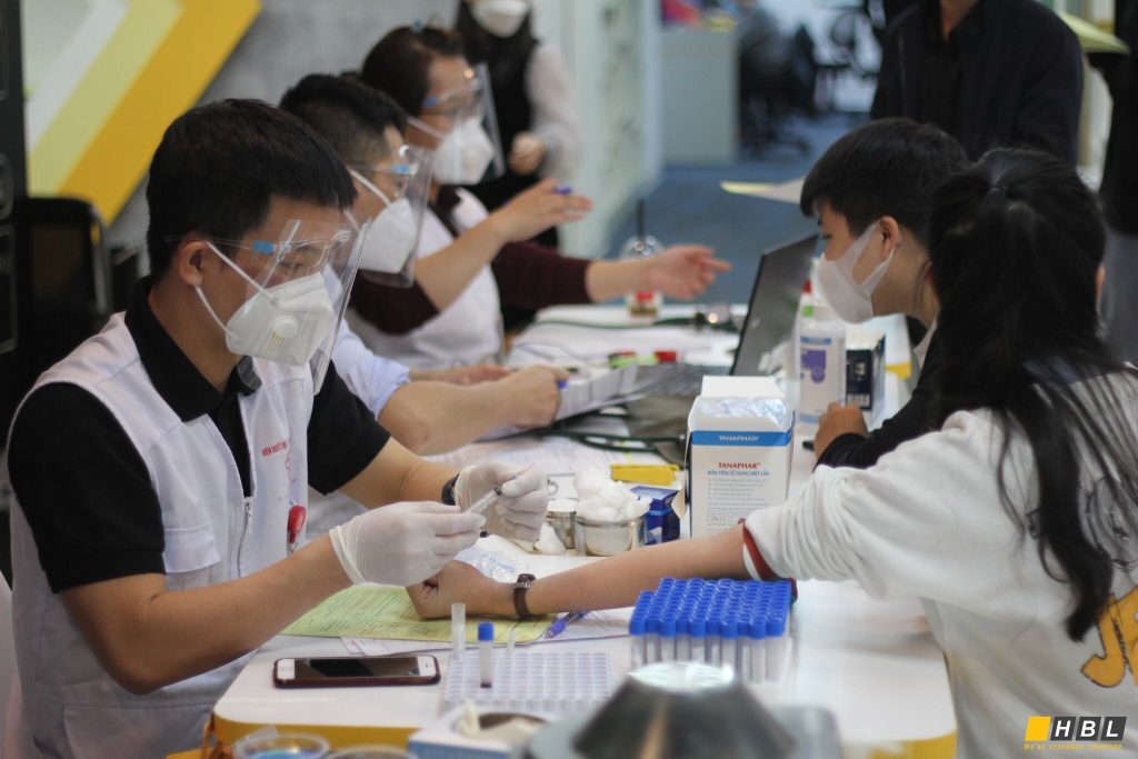 a man is giving blood at the blood donation event